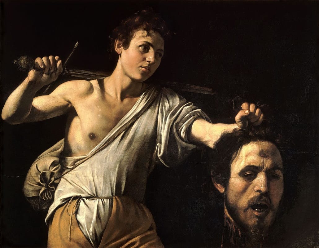Caravaggio’s oil painting ‘David with the Head of Goliath,’ showing a young man holding a sword over his shoulder and displaying the severed head of Goliath.
