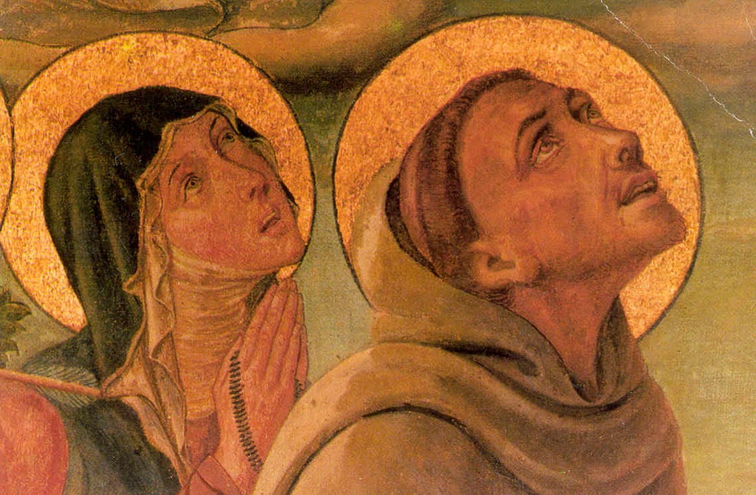 Fresco detail of two haloed figures, a woman with hands clasped in prayer and a man looking upward, both gazing toward a crucifix above.