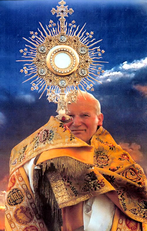 Saint John Paul II raising a golden monstrance, in gold vestments against a blue sky.