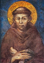 Detail of the Cimabue fresco of Saint Francis of Assisi in brown habit, hands folded showing stigmata, golden halo on blue ground.