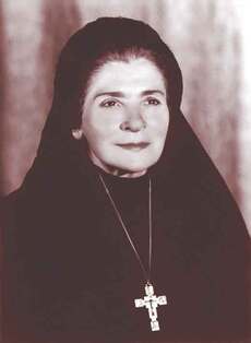 Formal portrait photograph of Mother Eugenia Elisabetta Ravasio in a black habit and white veil, wearing a large pectoral cross.